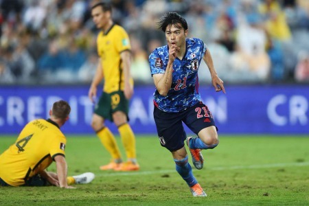 Brighton forward Kaoru Mitoma came off the bench to score a late brace to beat Australia and send Japan to the World Cup